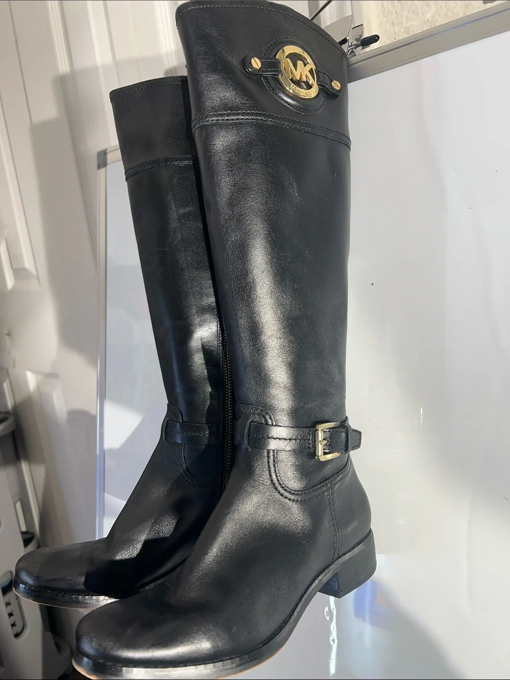 Knee-high leather boots with MK logo